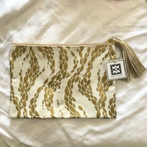 🔴NWT White And Gold Zipper Movement Pouch with Tassel